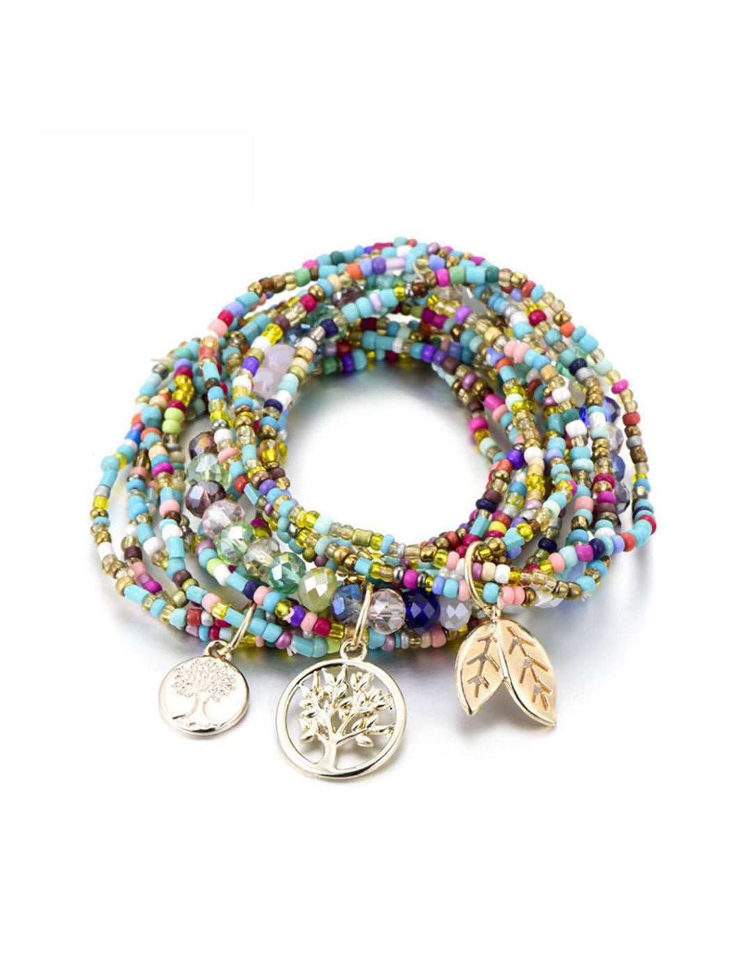 Lovra bracelet with leaf pendant resting on wooden surface highlighting design details