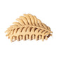 Beau hair clip placed on natural wooden surface