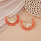 Detailed shot of woven raffia material in Earedge fan shape earrings