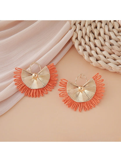 Detailed shot of woven raffia material in Earedge fan shape earrings