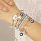 Close-up of Lovra vintage inspired bracelet with multicolored beads and gold accents