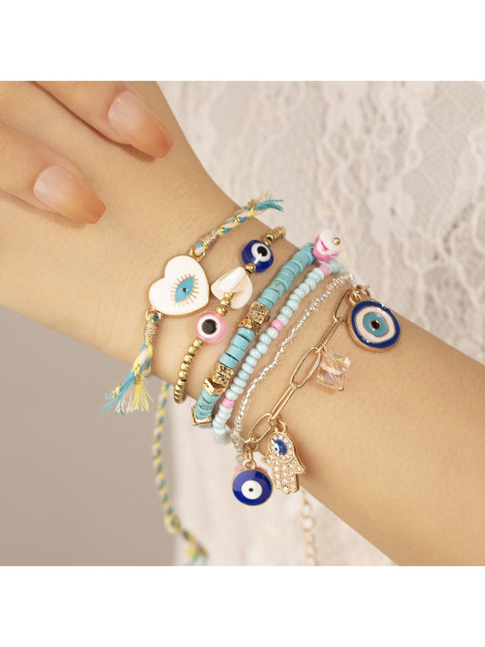 Close-up of Lovra vintage inspired bracelet with multicolored beads and gold accents