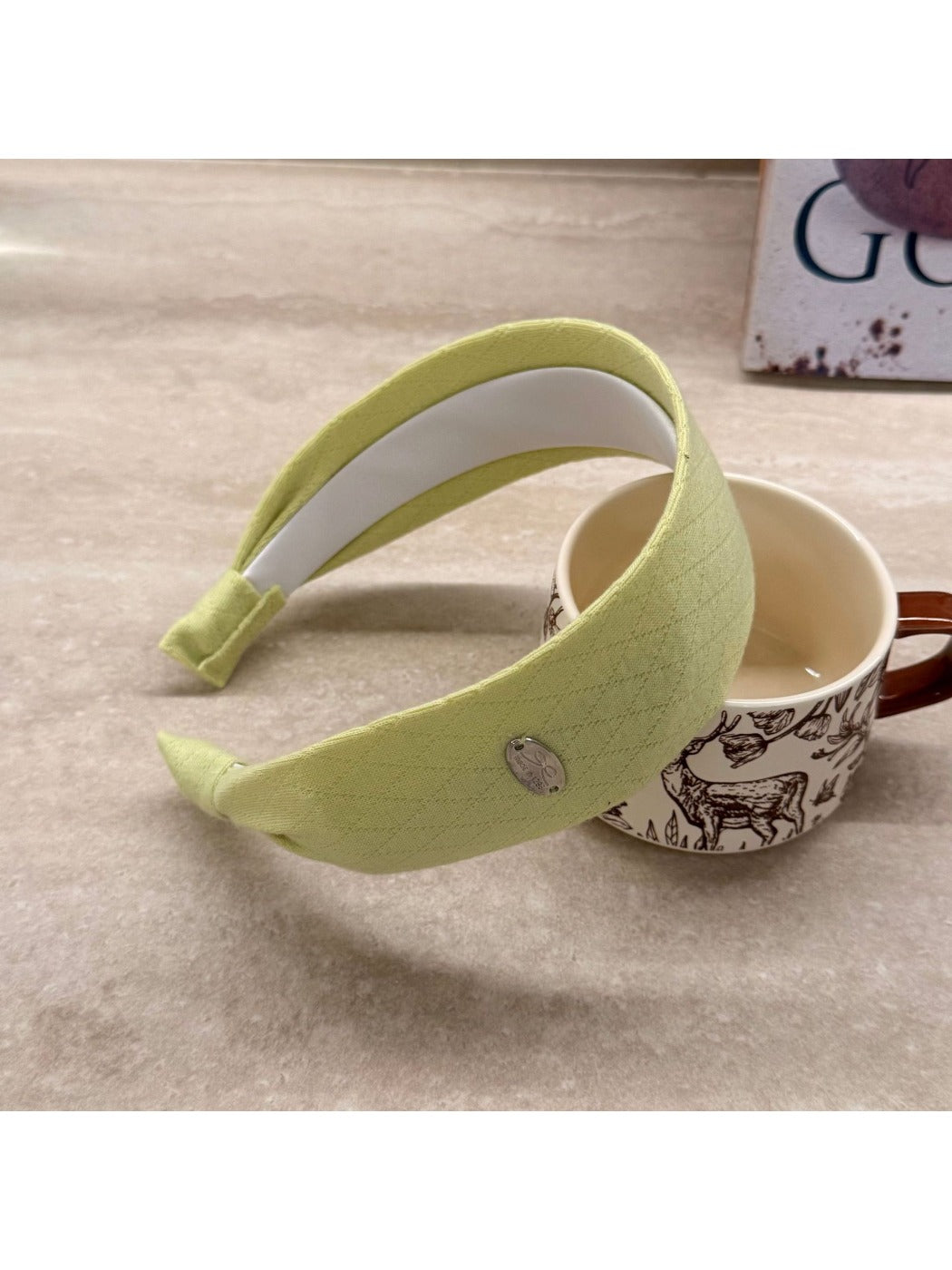 Gifty wide headband in solid color styled with hair pulled back