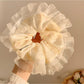 Gifty Ditsy Floral Lace Trim Scrunchie styled in hair with visible floral print and lace trim