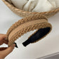 Gifty headband placed on white background emphasizing its unique pastel color