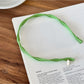 Gifty headband folded flat showing elastic band and fabric details