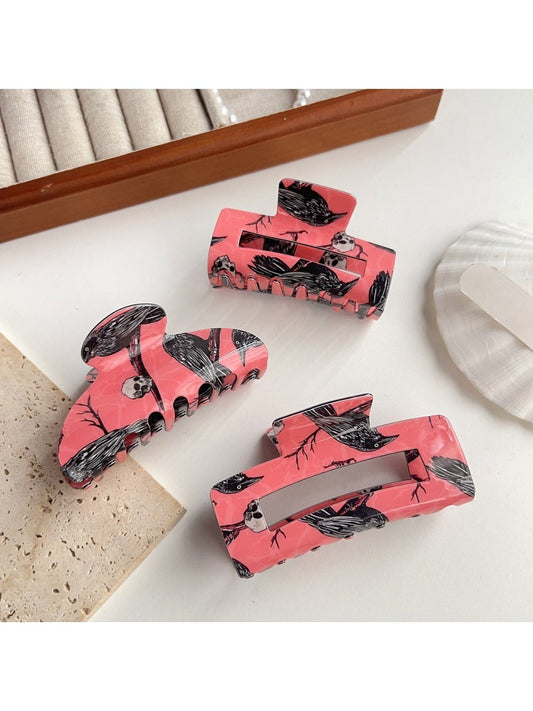 Beau hair claw clip with delicate crow pattern on black plastic