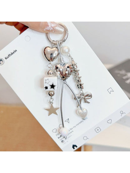 Keypus cute star and bow charm keychain with gold ring on white background