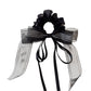 Top view of Gifty scrunchie highlighting the layered ribbon design