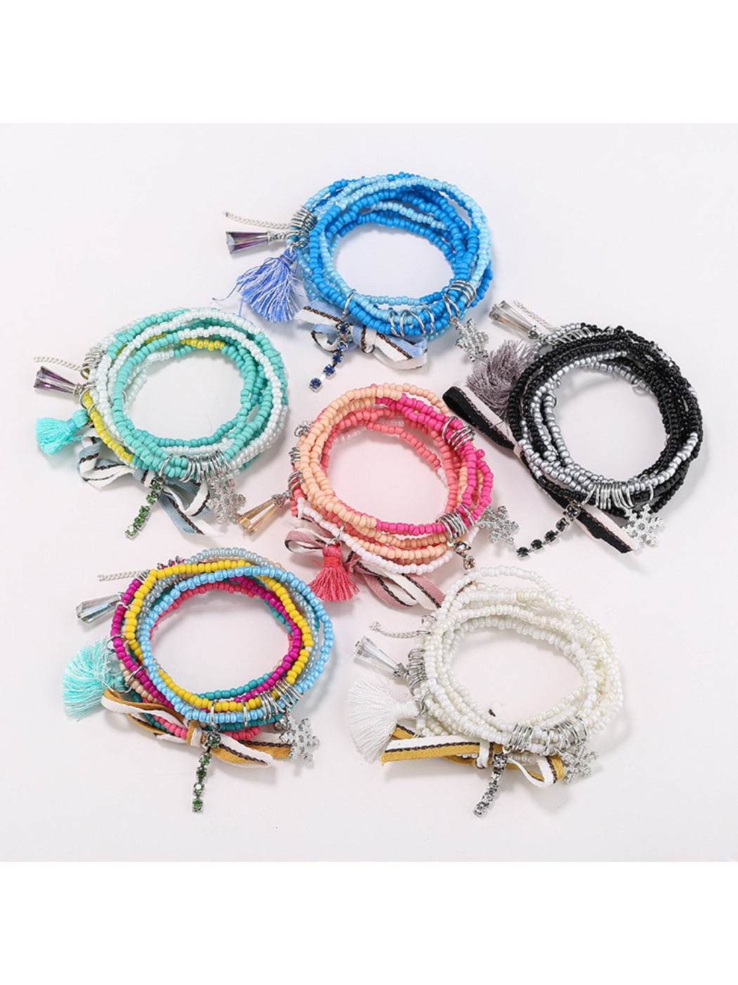 Lovra chic multi strand beaded bracelet with gold and black beads on white background
