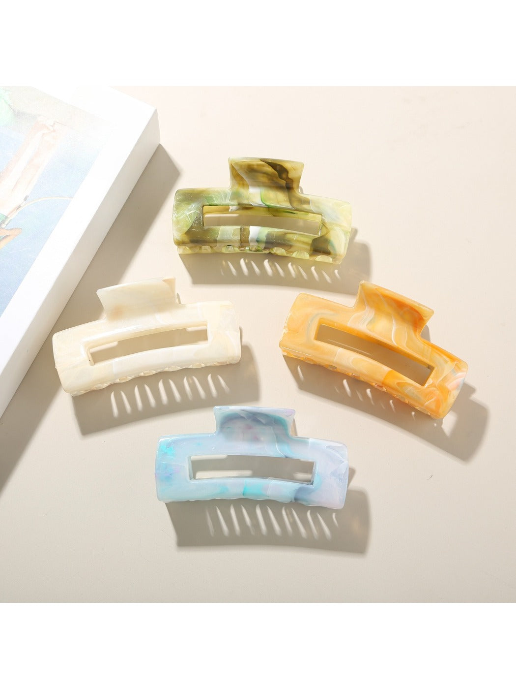 Close-up of Beau rectangular hair clip showing smooth edges and tortoiseshell design