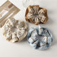 Gifty Pretty Dreamy pastel scrunchie in soft pink fabric with subtle sheen