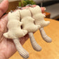 Back view of the bear keychain displaying the full length of its tail