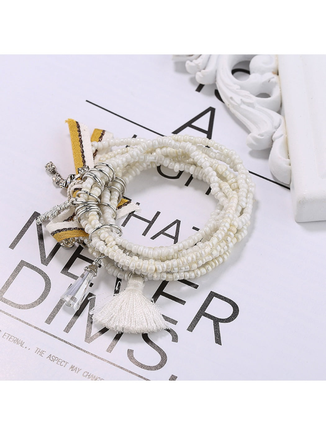 Side view of Lovra beaded bracelet highlighting layered strands and clasp