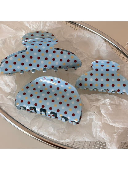 Side view of Beau blue polka dot hair clip with metal clasp