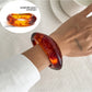 Lovra vintage polished irregular bangle bracelet styled with casual outfit