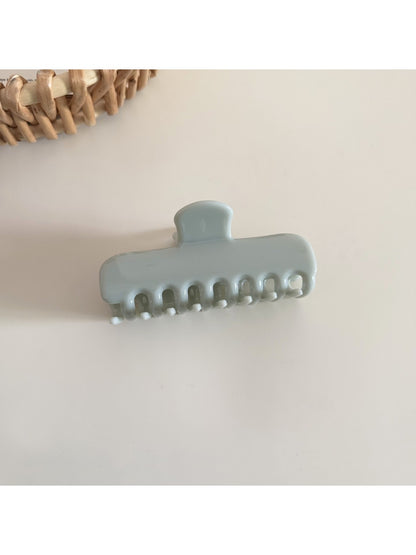 Beau rectangular hair clip in pastel yellow shown from top angle