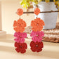 Artistic shot of colorful Bohemian drop earrings highlighting texture and colors