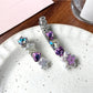 Beau hair clip showing flower design with rhinestones on a white background