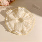 Close-up of Gifty elegant simple ruched scrunchie in soft fabric