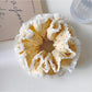 Gifty polka dot double layer lace scrunchie stretched to show elasticity and layers