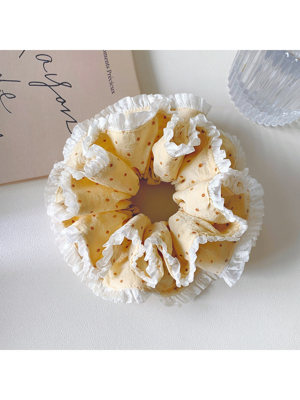Gifty polka dot double layer lace scrunchie stretched to show elasticity and layers