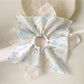 Multiple Gifty scrunchies displayed in a flat lay with vibrant patterns and textures
