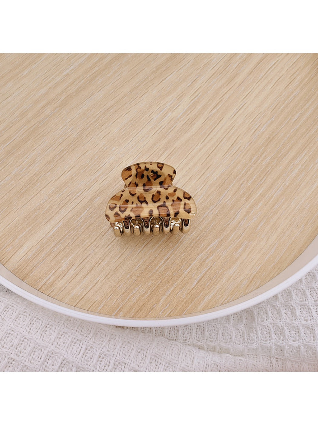 Side view of Beau medium half ponytail claw clip in light beige color