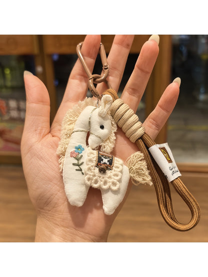 Back view of fabric pony keychain showing tail and stitching details
