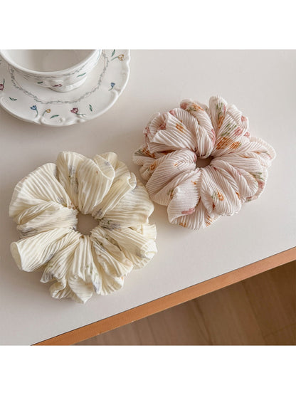 Close-up of Gifty fashionable printed ruched scrunchie in floral pattern