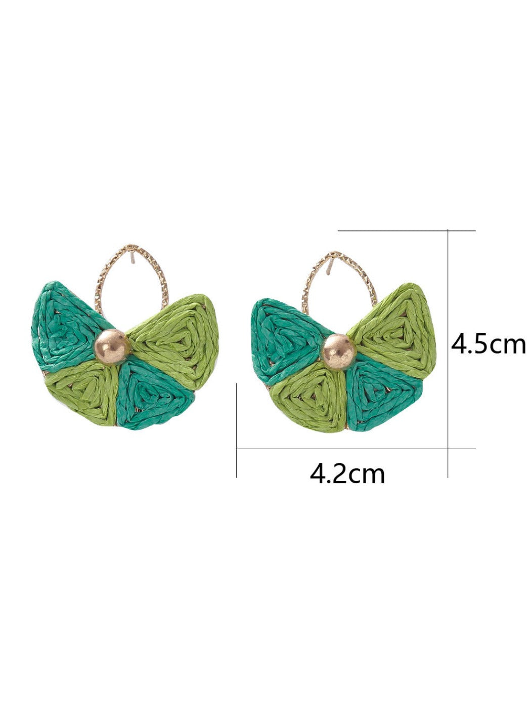 Pair of vintage fan shaped raffia earrings displayed on a wooden surface