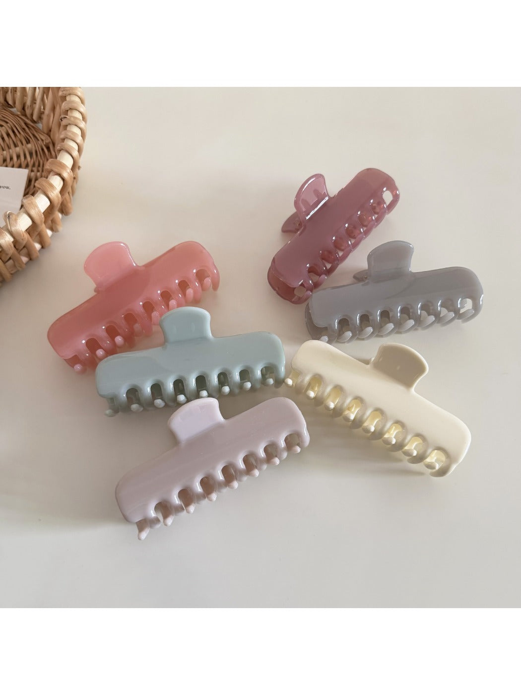 Close-up of Beau rectangular hair clip showing smooth pastel pink surface