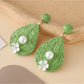 Earedge teardrop drop earrings styled with matching necklace and bracelet