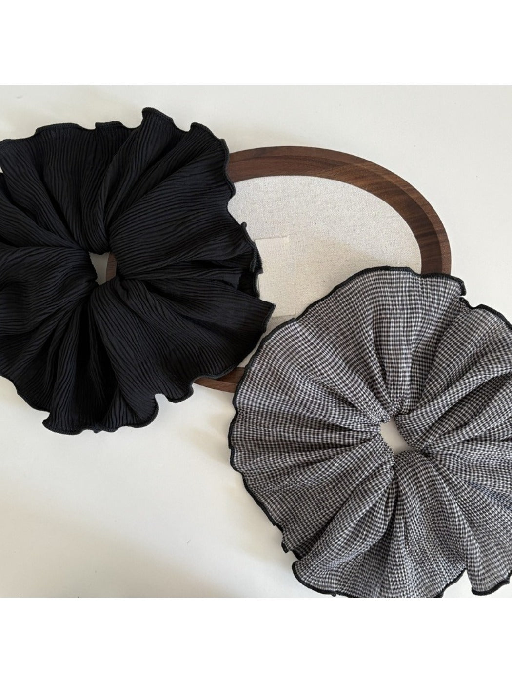 Close-up of Gifty vintage plaid fabric scrunchie in brown and beige tones