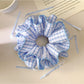 Blue plaid double layer hair scrunchie wrapped around a ponytail