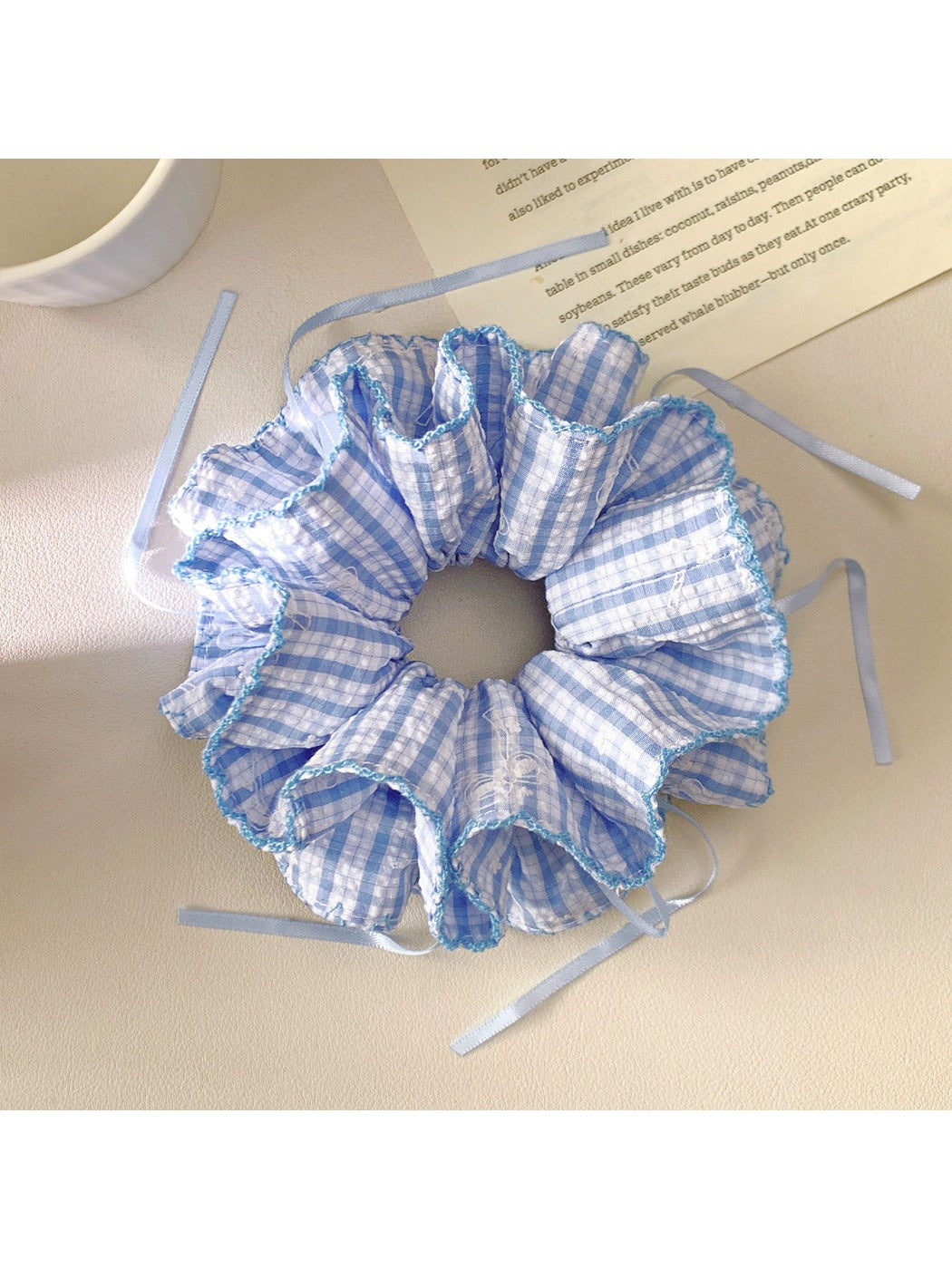 Blue plaid double layer hair scrunchie wrapped around a ponytail
