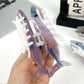 Side view of Beau minimalist shark hair claw clip highlighting curved teeth