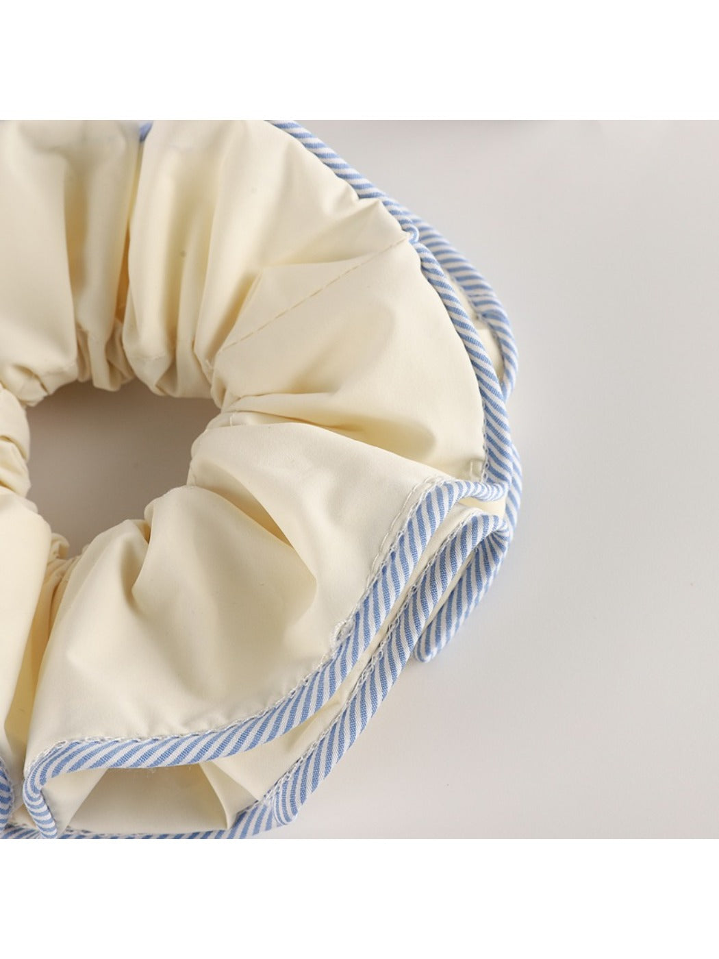 Gifty double layer scrunchie styled on a wrist as a fashion accessory