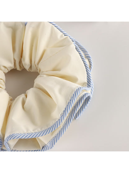Gifty double layer scrunchie styled on a wrist as a fashion accessory