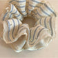 Flat lay of Gifty minimalist scrunchie with subtle stripes on a wooden surface