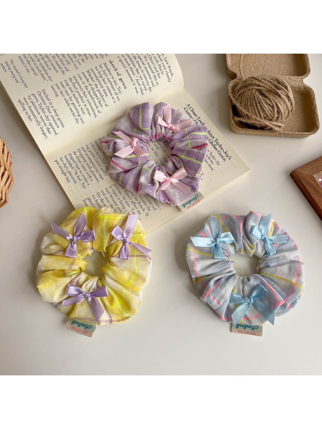 Close-up of Gifty Ribbon Bow Plaid Scrunchie showing fabric texture and bow detail