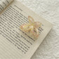 Beau acetate butterfly shaped claw clip positioned to highlight butterfly wings design