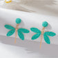 Raffia dragonfly earrings in a gift box with soft fabric lining