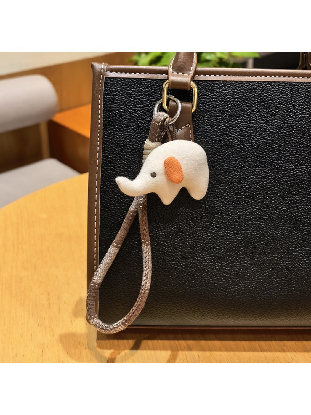 Elephant charm keychain displayed on a white background