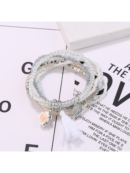 Close-up of Lovra bracelet showing detailed multi-row beaded design and tassel