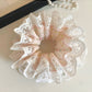 Model wearing Gifty sweet light pink scrunchie in hair