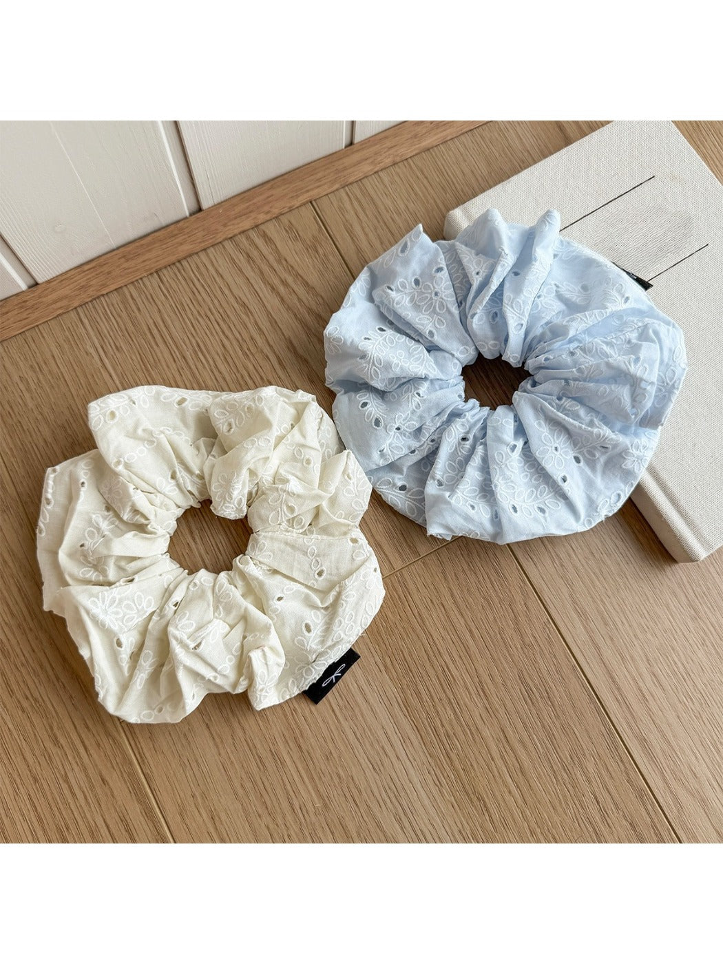 Close-up of Gifty scrunchie showing detailed cutout print design