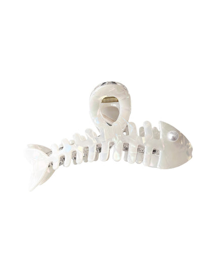 Beau fishbone acetate hair clip held in hand showing size and shape