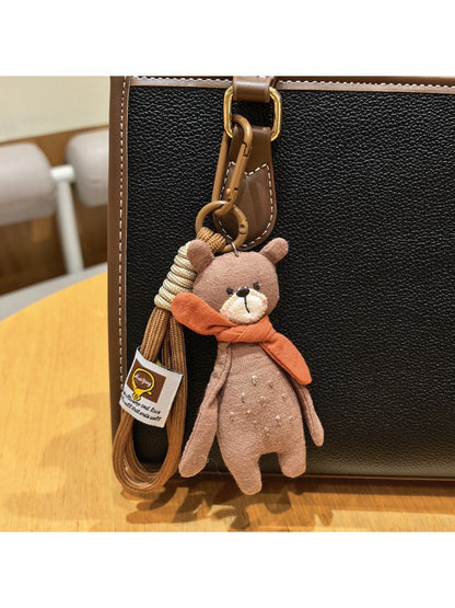 Bear keychain held in hand to show size and scale