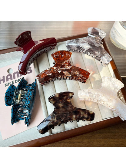 Close-up of Beau acetate claw clip showing smooth curved edges and glossy finish